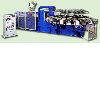 Rotary type plastic shoe making machine